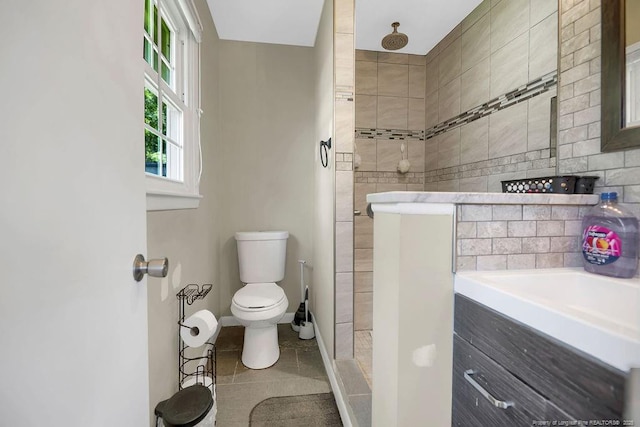 6582 Vineyard Dr, Fayetteville, NC 28304 - full bath with a tile shower, toilet, tile patterned floors, and vanity