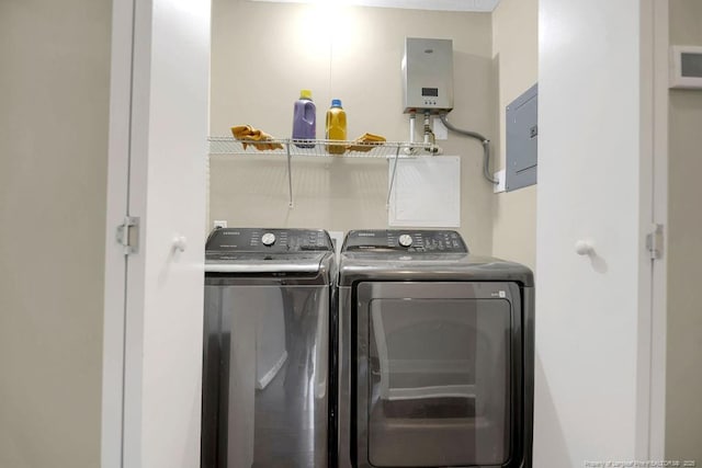 6582 Vineyard Dr, Fayetteville, NC 28304 - laundry room featuring tankless water heater, washer and clothes dryer, and electric panel