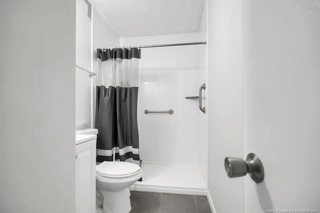 6582 Vineyard Dr, Fayetteville, NC 28304 - bathroom featuring a shower stall, toilet, tile patterned flooring, vanity, and a textured ceiling