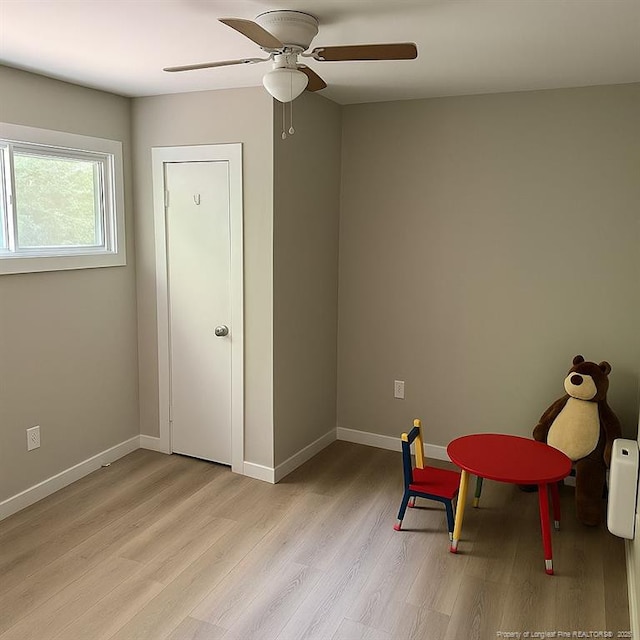 432 Squirrel St, Fayetteville, NC 28303 - living area with a ceiling fan, light wood-style flooring, and baseboards