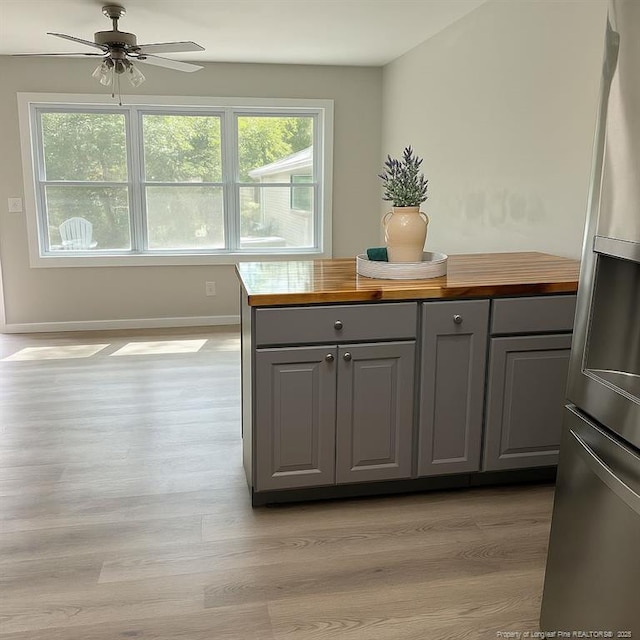 432 Squirrel St, Fayetteville, NC 28303 - kitchen featuring freestanding refrigerator, gray cabinetry, wood counters, and plenty of natural light