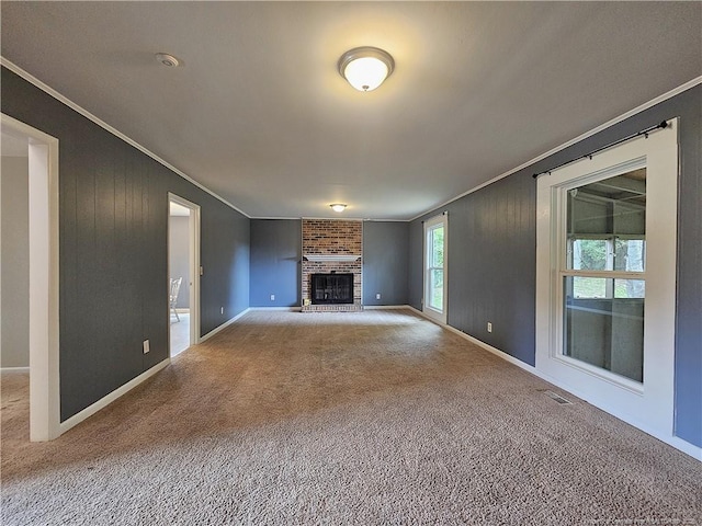 918 Dandridge Dr, Fayetteville, NC 28303 - unfurnished living room with ornamental molding, carpet flooring, baseboards, and a brick fireplace