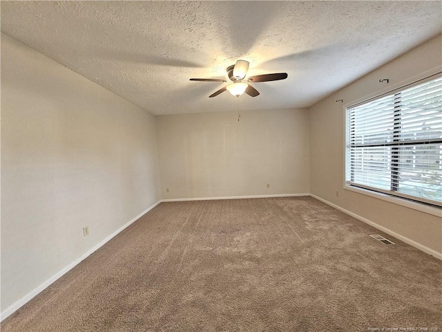 918 Dandridge Dr, Fayetteville, NC 28303 - unfurnished room featuring ceiling fan, carpet, a textured ceiling, and baseboards