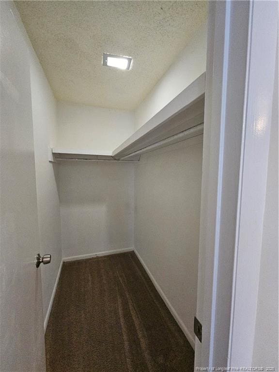 918 Dandridge Dr, Fayetteville, NC 28303 - spacious closet featuring dark carpet
