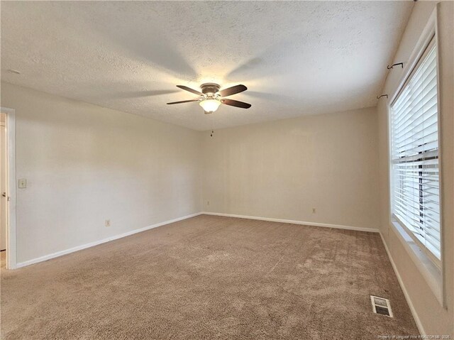 918 Dandridge Dr, Fayetteville, NC 28303 - carpeted empty room featuring ceiling fan, a textured ceiling, and baseboards