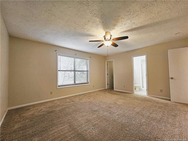 918 Dandridge Dr, Fayetteville, NC 28303 - unfurnished bedroom featuring carpet, baseboards, a textured ceiling, ensuite bath, and a ceiling fan