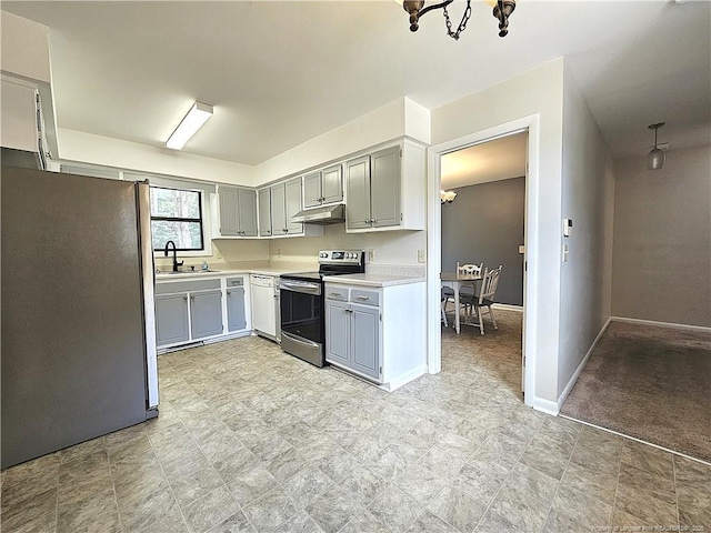 918 Dandridge Dr, Fayetteville, NC 28303 - kitchen featuring stainless steel appliances, under cabinet range hood, a sink, a chandelier, and light countertops