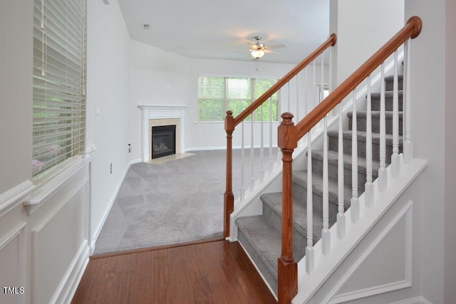 321 Westgrove Ct, Durham, NC 27703 - stairs with ceiling fan, a high end fireplace, and wood finished floors