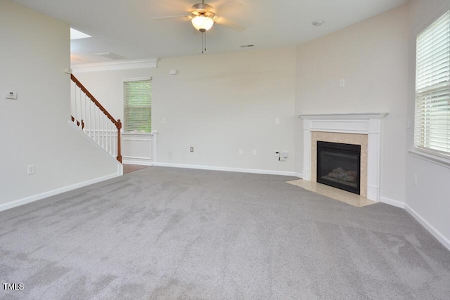 321 Westgrove Ct, Durham, NC 27703 - unfurnished living room with ceiling fan, a fireplace with flush hearth, carpet floors, stairs, and healthy amount of natural light