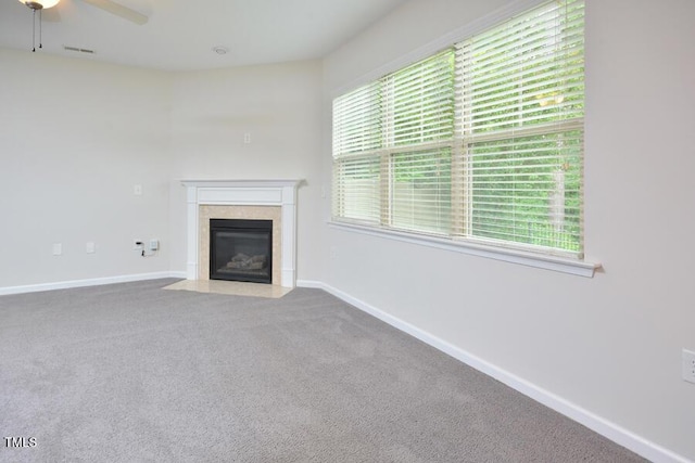 321 Westgrove Ct, Durham, NC 27703 - unfurnished living room featuring ceiling fan, a tile fireplace, and carpet floors