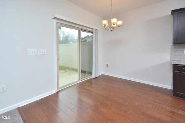 321 Westgrove Ct, Durham, NC 27703 - unfurnished dining area with a chandelier and dark wood-style flooring
