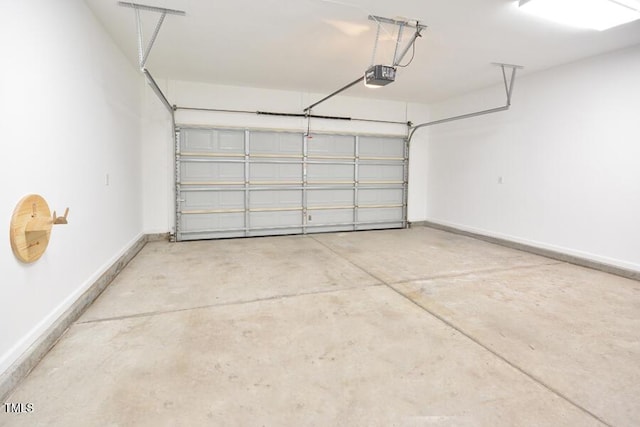 321 Westgrove Ct, Durham, NC 27703 - garage featuring a garage door opener and baseboards