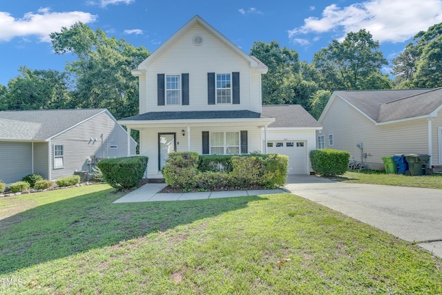 5617 Tealbrook Dr, Raleigh, NC 27610 - traditional home featuring a garage, concrete driveway, a porch, and a front lawn