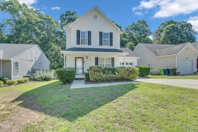 5617 Tealbrook Dr, Raleigh, NC 27610 - traditional-style house featuring driveway, a front yard, a garage, and a porch