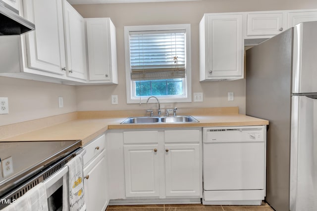 5617 Tealbrook Dr, Raleigh, NC 27610 - kitchen featuring stainless steel appliances, extractor fan, white cabinets, and light countertops