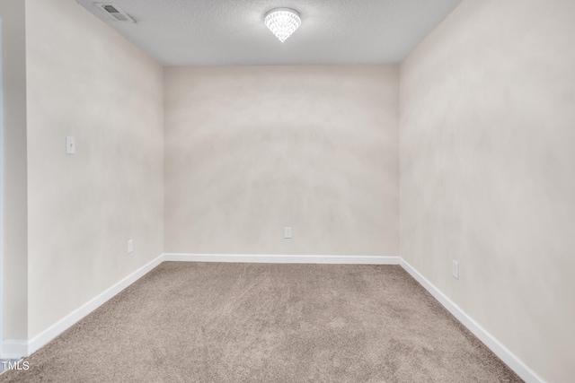 5617 Tealbrook Dr, Raleigh, NC 27610 - carpeted spare room featuring baseboards and a textured ceiling