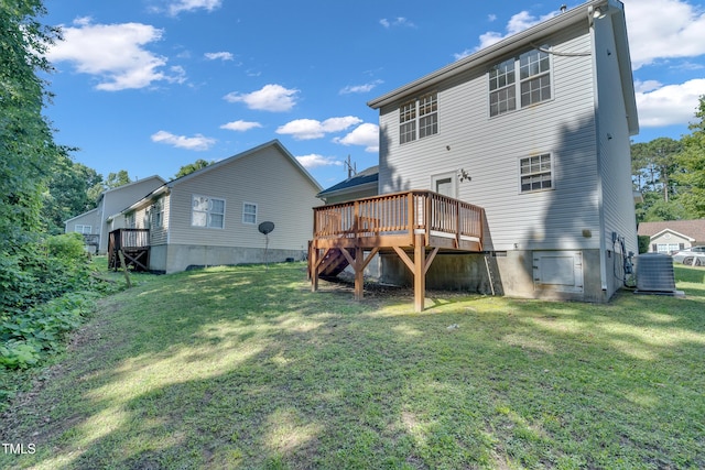 5617 Tealbrook Dr, Raleigh, NC 27610 - rear view of house with a wooden deck and a lawn