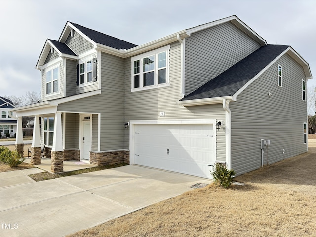 13 Knotty Pine Ln, Clayton, NC 27520 - craftsman inspired home featuring a garage, driveway, roof with shingles, and covered porch