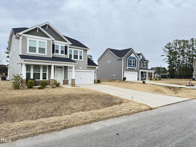 13 Knotty Pine Ln, Clayton, NC 27520 - craftsman inspired home featuring covered porch, an attached garage, concrete driveway, stone siding, and central air condition unit