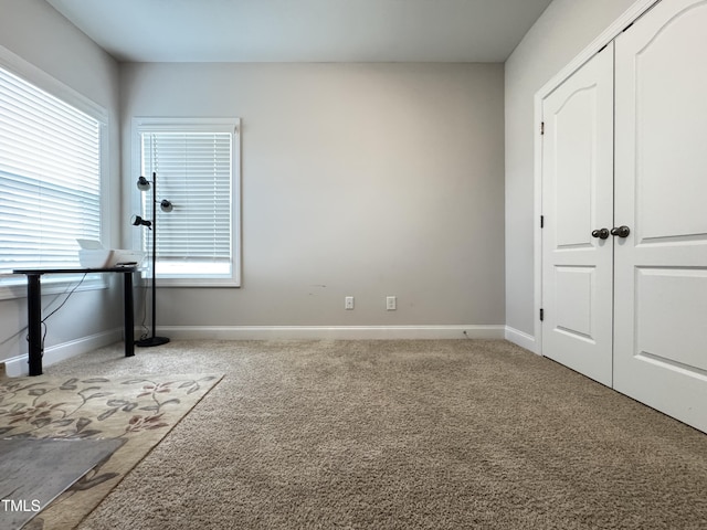 13 Knotty Pine Ln, Clayton, NC 27520 - unfurnished bedroom with carpet floors, baseboards, and a closet