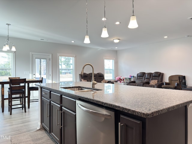 13 Knotty Pine Ln, Clayton, NC 27520 - kitchen featuring stainless steel dishwasher, a sink, healthy amount of natural light, a kitchen island with sink, and recessed lighting