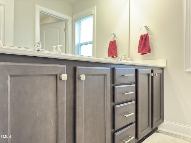 13 Knotty Pine Ln, Clayton, NC 27520 - bathroom featuring double vanity and baseboards