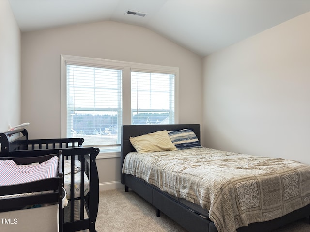 13 Knotty Pine Ln, Clayton, NC 27520 - bedroom with light carpet, vaulted ceiling, and baseboards