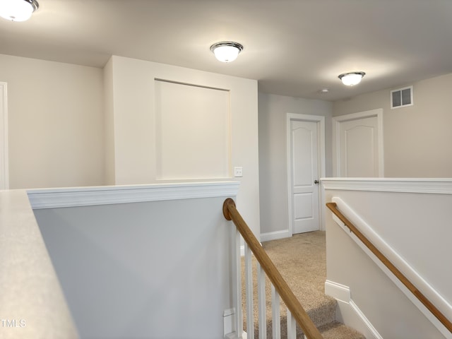13 Knotty Pine Ln, Clayton, NC 27520 - corridor with an upstairs landing, light carpet, and baseboards