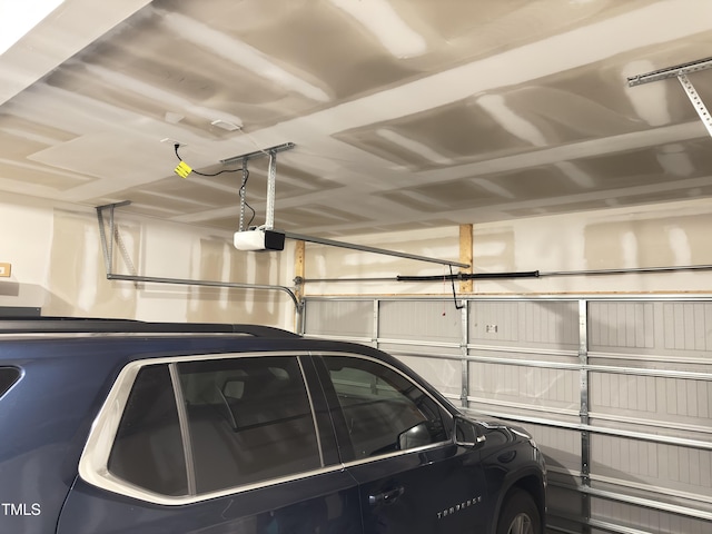 13 Knotty Pine Ln, Clayton, NC 27520 - garage featuring a garage door opener