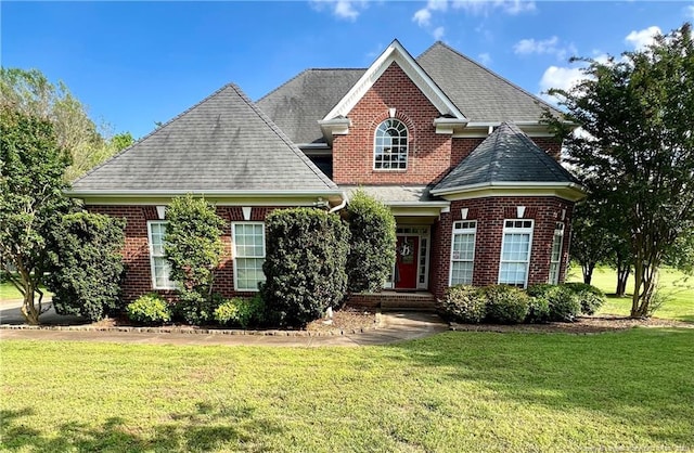 9721 Arlington Oaks Dr, Charlotte, NC 28227 - view of front of home with a front lawn, brick siding, and roof with shingles