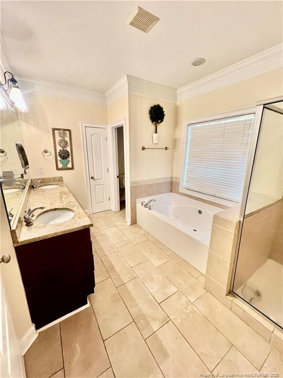 9721 Arlington Oaks Dr, Charlotte, NC 28227 - bathroom featuring a garden tub, double vanity, ornamental molding, a stall shower, and tile patterned flooring
