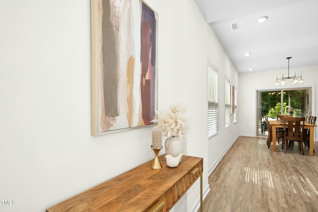 137 Azalea View Way, Holly Springs, NC 27540 - hall with a chandelier, wood finished floors, and recessed lighting