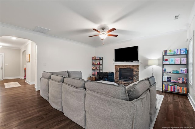 5540 Mountain Run Dr, Hope Mills, NC 28348 - living area with arched walkways, ornamental molding, dark wood-type flooring, ceiling fan, and baseboards