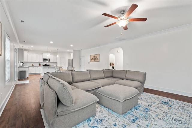 5540 Mountain Run Dr, Hope Mills, NC 28348 - living area with arched walkways, ceiling fan, wood finished floors, baseboards, and recessed lighting