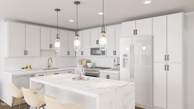 140 Two Hills Dr Unit 302C, Carrboro, NC 27510 - kitchen featuring stainless steel appliances, a sink, backsplash, a breakfast bar area, and pendant lighting