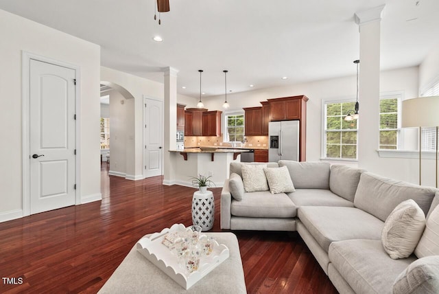 108 Teagan Ct, Chapel Hill, NC 27516 - living area featuring arched walkways, dark wood-type flooring, plenty of natural light, ceiling fan, and recessed lighting