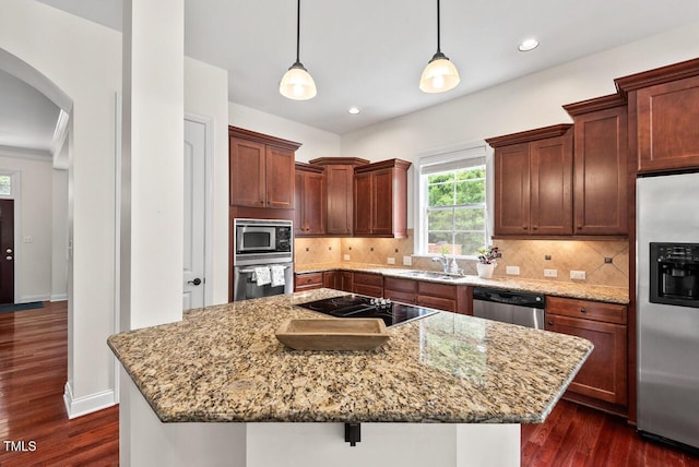 108 Teagan Ct, Chapel Hill, NC 27516 - kitchen with stainless steel appliances, arched walkways, dark wood-style floors, light stone counters, and tasteful backsplash