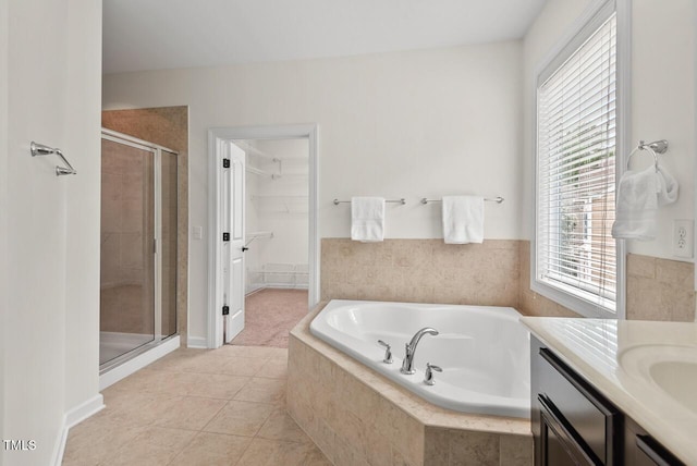 108 Teagan Ct, Chapel Hill, NC 27516 - bathroom with a stall shower, a garden tub, tile patterned flooring, vanity, and a walk in closet