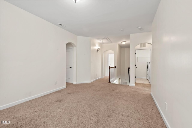 108 Teagan Ct, Chapel Hill, NC 27516 - carpeted empty room with arched walkways, attic access, and washer / dryer