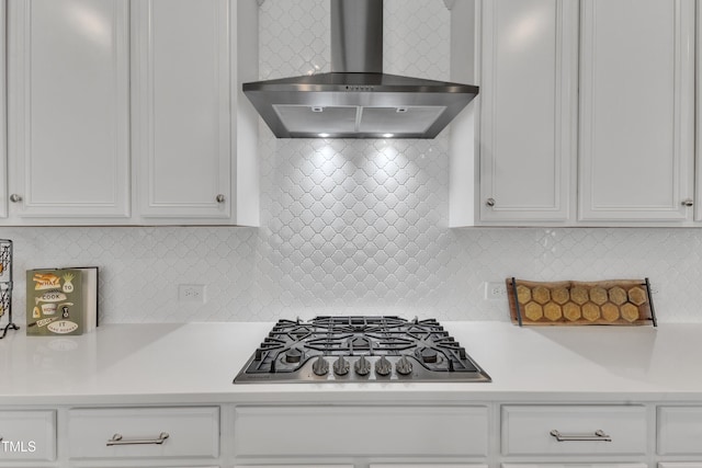2969 Thirlestane Dr, Apex, NC 27502 - kitchen with wall chimney range hood, stainless steel gas cooktop, light countertops, and white cabinets
