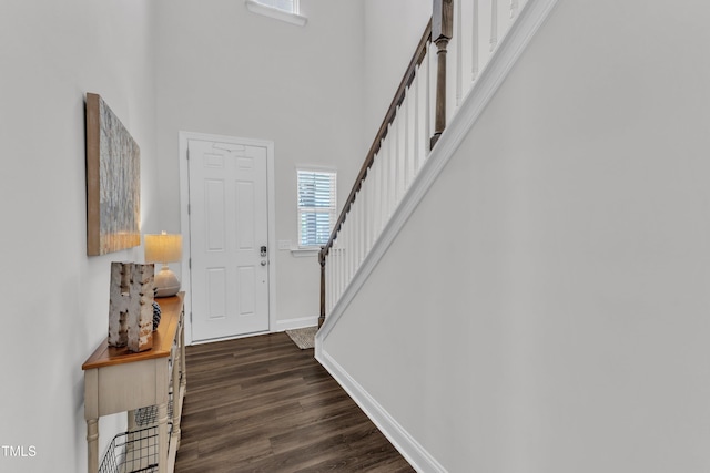 2969 Thirlestane Dr, Apex, NC 27502 - entrance foyer featuring a towering ceiling, stairway, and dark wood-type flooring