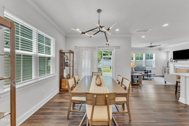2969 Thirlestane Dr, Apex, NC 27502 - dining area featuring crown molding, recessed lighting, a chandelier, dark wood-style flooring, and ceiling fan