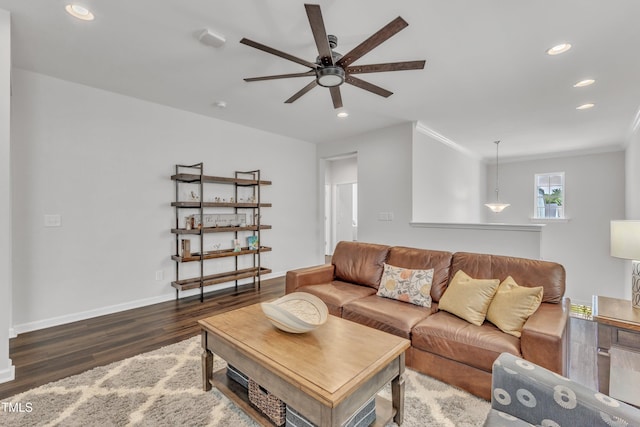 2969 Thirlestane Dr, Apex, NC 27502 - living area featuring wood finished floors, a ceiling fan, recessed lighting, and crown molding