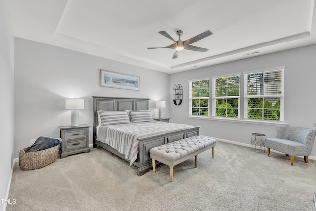 2969 Thirlestane Dr, Apex, NC 27502 - carpeted bedroom with a tray ceiling and a ceiling fan