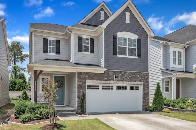 2969 Thirlestane Dr, Apex, NC 27502 - craftsman-style house with a garage, driveway, stone siding, and a shingled roof