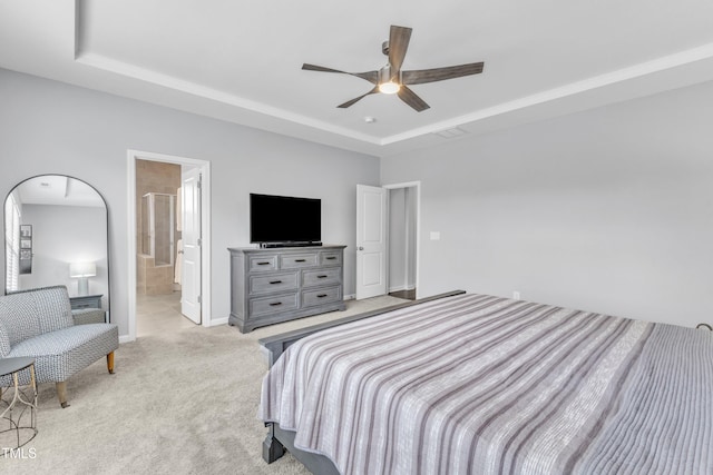 2969 Thirlestane Dr, Apex, NC 27502 - carpeted bedroom with a raised ceiling, a ceiling fan, and ensuite bathroom