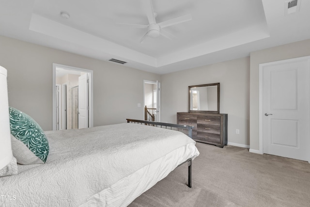 2537 Sunnybranch Ln, Apex, NC 27523 - carpeted bedroom featuring a tray ceiling and a ceiling fan