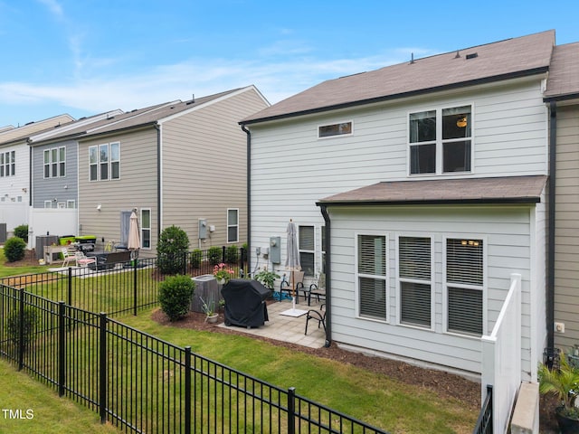 1038 Felman Rd, Durham, NC 27703 - rear view of house featuring a patio area and a fenced backyard