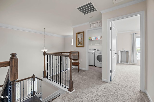 1038 Felman Rd, Durham, NC 27703 - corridor with an upstairs landing, carpet flooring, crown molding, and washer and dryer