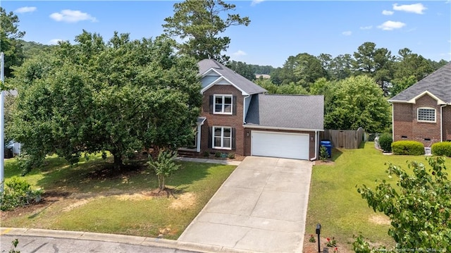 3517 Gables Dr, Fayetteville, NC 28311 - view of front of house with concrete driveway, an attached garage, brick siding, and view of wooded area